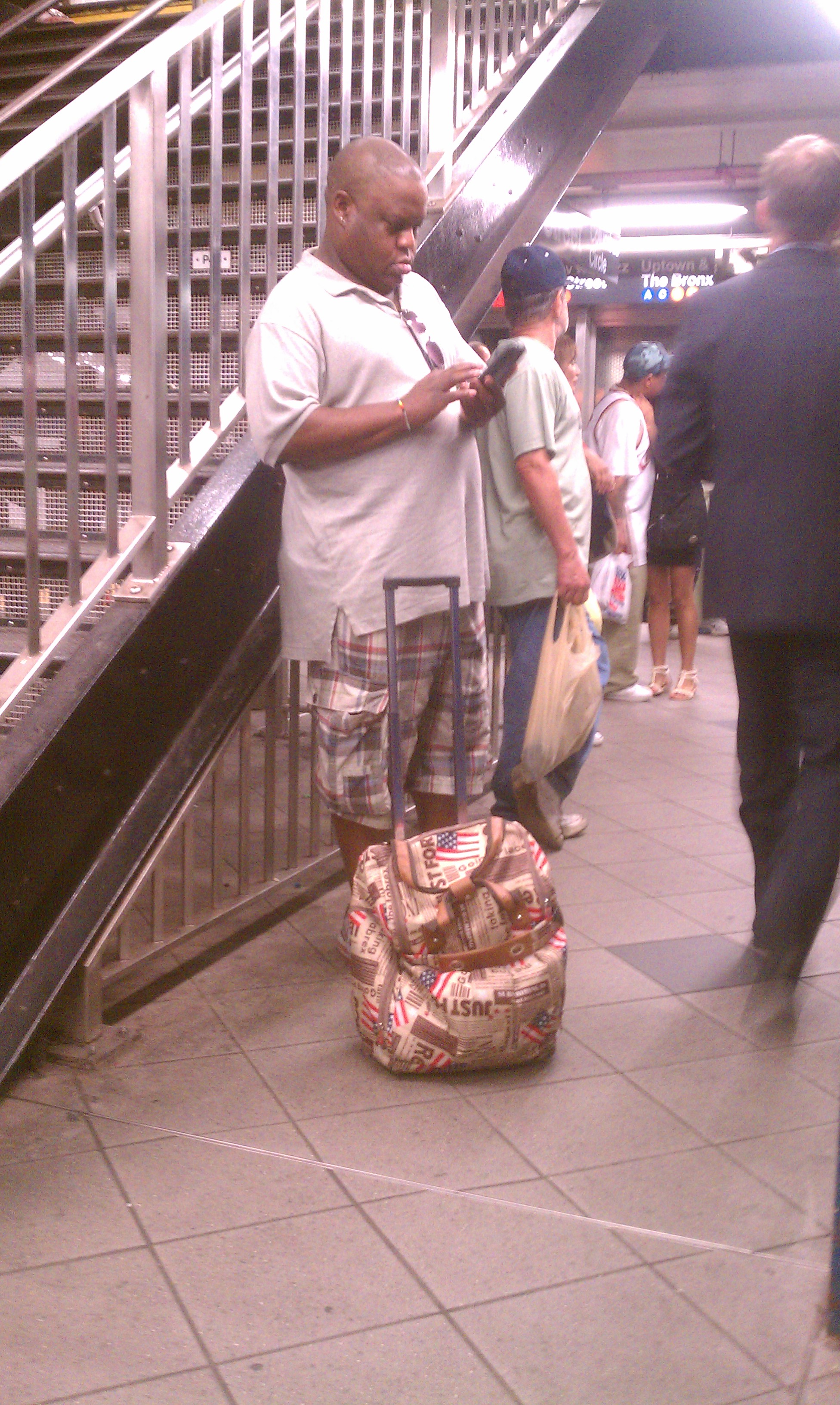 Notice his rolling American flag backpack.